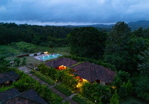 A la foto es mostra l'objecte Clover Holiday Village Coorg Resort by VOYE HOMES situat a la ciutat de Arkalgūd.