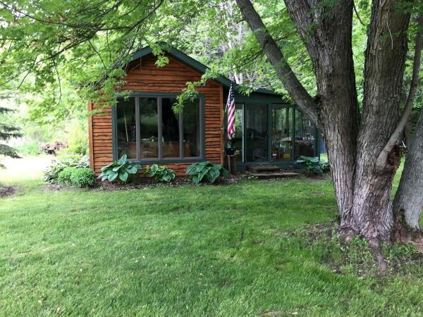 The photo shows the Picturesque Cabin Retreat with Private Sauna near New Richmond, Wisconsin located in the city of Baldwin.