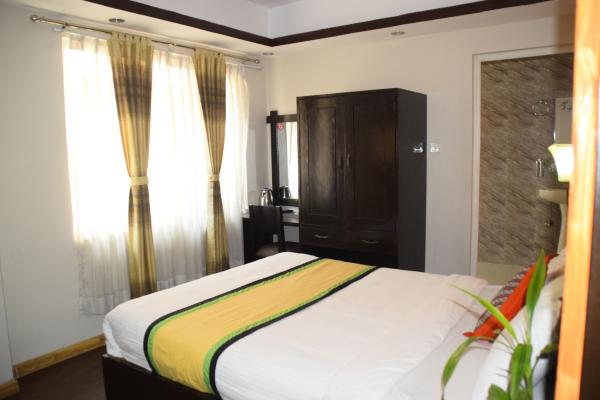 Fotografia 1: Simple & Sustainable- Room with facilities a guest need