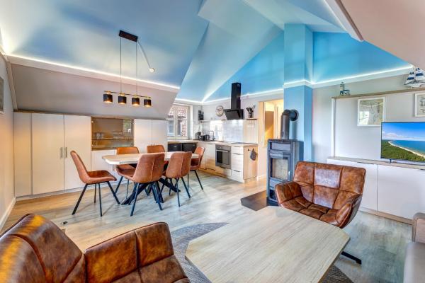 A la foto es mostra l'objecte Dünenhaus Ückeritz UnserUsedomDe FeWo ca75qm mit privater Sauna und Kamin Parkplatz direkt am Strand 10I3 situat a la ciutat de Ueckeritz.