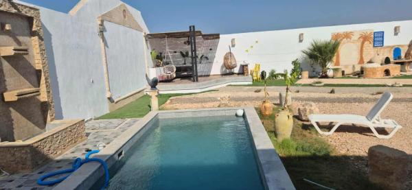 Op de foto is het object Dar Dalloula maison de vacances espace detente te zien, gelegen in de stad Al Māʼīyah.