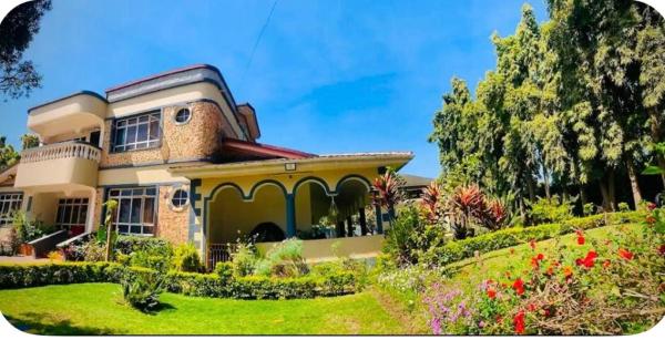 På billedet ses objektet Giving Hands Homestay beliggende i byen Arusha.
