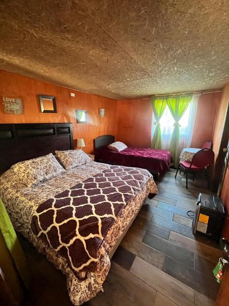 På bilden syns objektet Habitaciones triples PIA som ligger i staden Puerto Tranquilo.