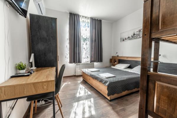The photo shows the Vitoshka Inn by BulgarianHomes located in the city of Sofia.