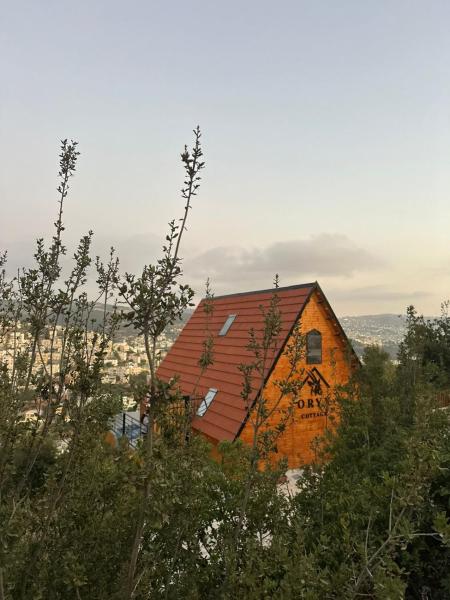 A la foto es mostra l'objecte أكواخ المها oryx cottage situat a la ciutat de ‘Ayn Jannā.