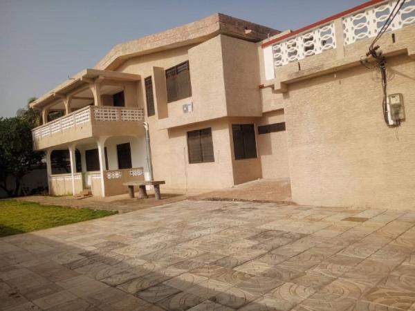 The photo shows the Enyo Home located in the city of Tema.