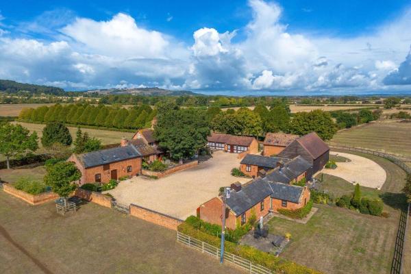 A la foto es mostra l'objecte Cotton Farm Estate - 4 Cottages Sleeps 16 situat a la ciutat de Dumbleton.