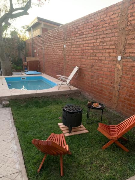 A la foto es mostra l'objecte Cozy House Malbec Route piscina parrilla bici 2 dormitorios situat a la ciutat de Maipú.