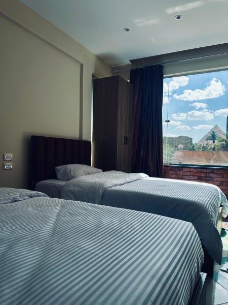 A la foto es mostra l'objecte pyramids Breeze View INN situat a la ciutat de El Caire.