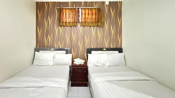 A la foto es mostra l'objecte Hotel Nirwana Sarangan situat a la ciutat de Sarangan.
