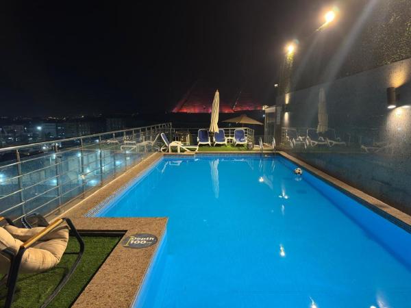 Nella foto è visibile l'oggetto Pyramids Charm Hotel situato nella città di Il Cairo.