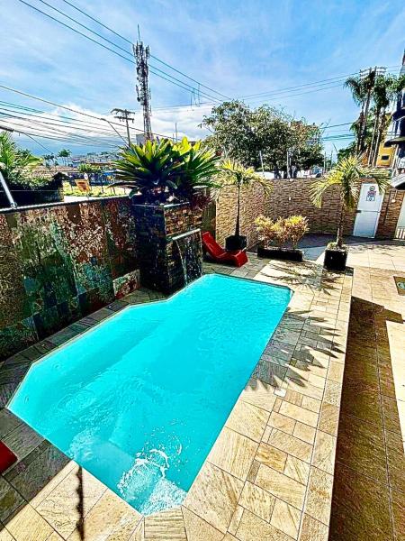På billedet ses objektet Casa Pé na Areia com Piscina Climatizada beliggende i byen Bertioga.