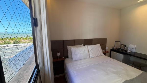 A la foto es mostra l'objecte Suite 1 quarto Camburi situat a la ciutat de Vitória.