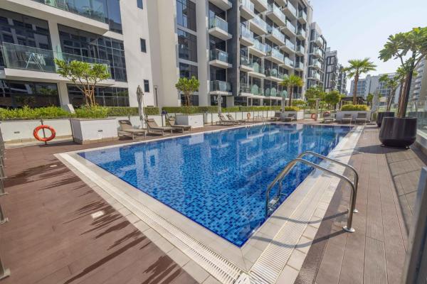 På billedet ses objektet Cozy Apartment in Azizi Riviera - 10 min to Burj Khalifa beliggende i byen Dubai.
