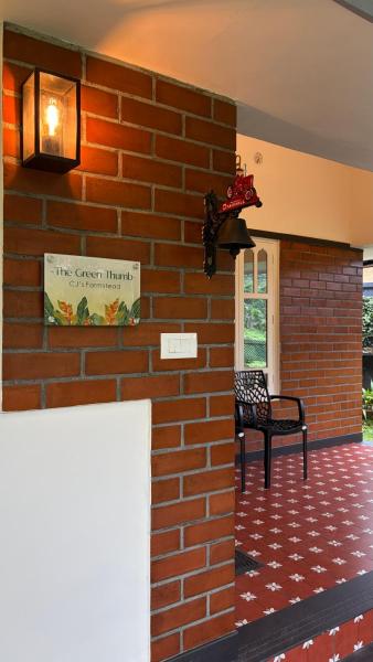 The photo shows the The Green Thumb Farm Stay located in the city of Erumeli.
