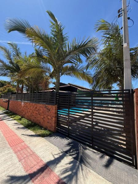 På billedet ses objektet Cantinho das Palmeiras Linda casa c piscina, p 12 pessoas, sossego beliggende i byen Ilha Itapeva.