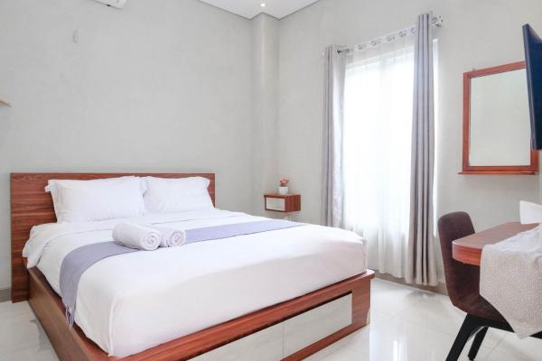 A la foto es mostra l'objecte Grha Minggiran Homestay Yogyakarta Mitra RedDoorz situat a la ciutat de Timuran.