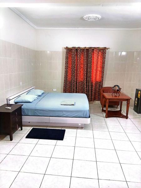 The photo shows the 2bed, Home Away from Home, Osu located in the city of Christiansborg.