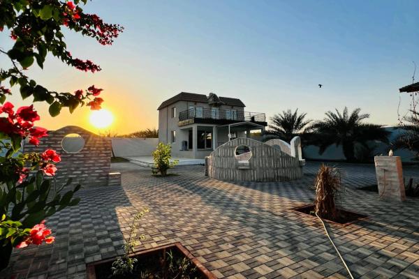 The photo shows the Abucho Rehmath Holidays Homes located in the city of Shimāl.