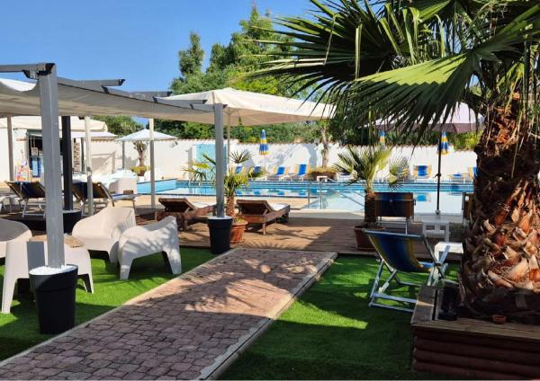 Nella foto è visibile l'oggetto Le Palme Holidays situato nella città di Palmadula.