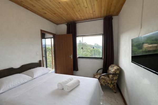 Auf dem Foto ist das Objekt Casa com 2 suítes e varanda em Lavras Novas in der Stadt Chapada zu sehen.