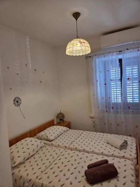 Na fotografii je vidět objekt Maslina Rooms Vodnjan nacházející se ve městě Vodnjan.