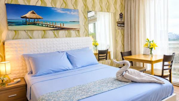 På bildet vises objektet Stay & Fly at Amani Grand Airport Studio with Pool Gym Netflix Fast WiFi 3 Guests som ligger i byen Mactan.