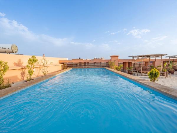 Auf dem Foto ist das Objekt Luxury Apartment with Pool, Hammam & Gym Guéliz 11 in der Stadt Marrakesch zu sehen.