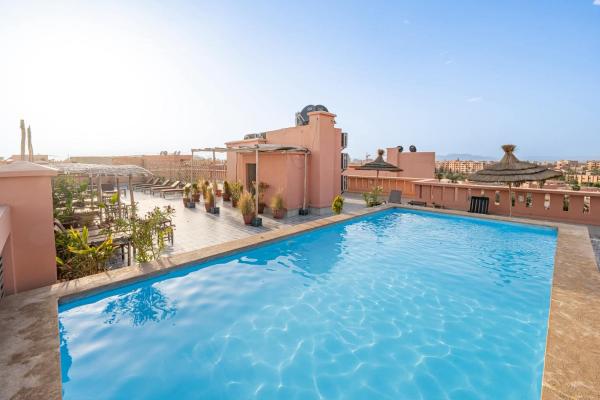 Auf dem Foto ist das Objekt Premium Apartment with Pool, Hammam & Gym Guéliz 12 in der Stadt Marrakesch zu sehen.