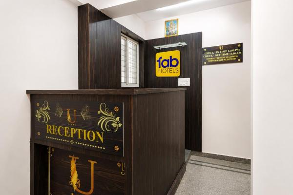 The photo shows the FabHotel Utsav Palace Inn located in the city of Bengaluru.