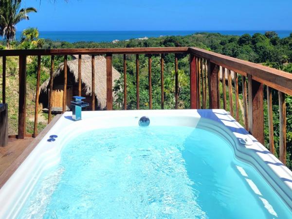 照片显示了位于La Poza市的Cabaña Guacamaya Vista al Mar y Jacuzzi Privado Cielva Tayrona物件。