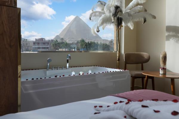 Na fotografii je vidět objekt pyramids palace view With Rooftop Access & free airport pickup nacházející se ve městě Káhira.