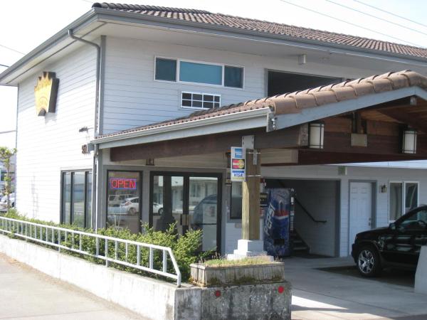 The photo shows the Crown Inn located in the city of Seattle.