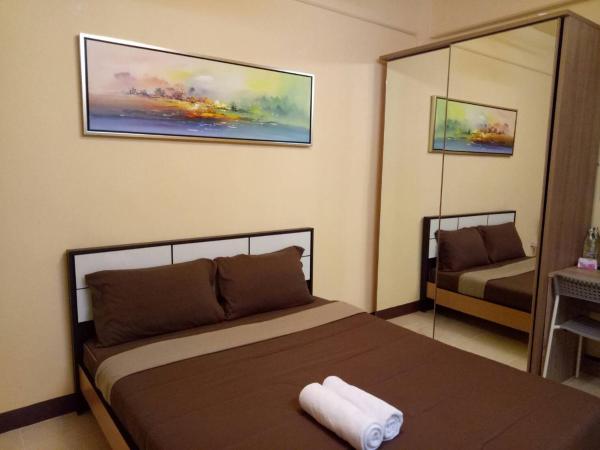 A la foto es mostra l'objecte Navavilla Serviced Apartment situat a la ciutat de Ban Lam Rua Taek.