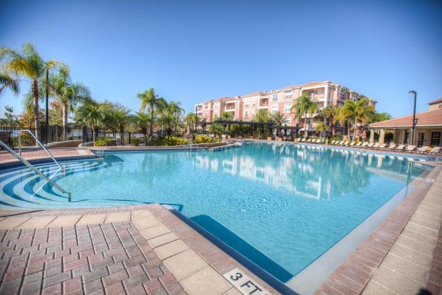 Top floor condo with view of lake, pool and fireworks! Next to Convention Center!