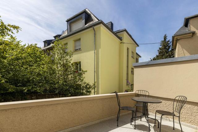 Elegant 1BR Retreat with Patio Near Kirchberg