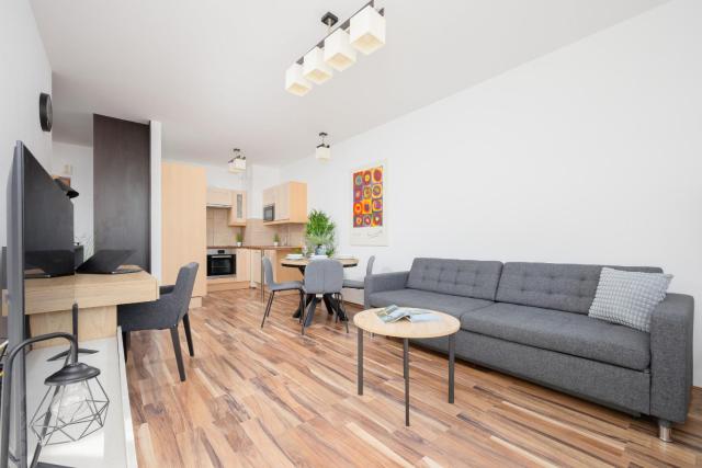 Spacious Apartment with Parking and Balcony by Noclegi Renters