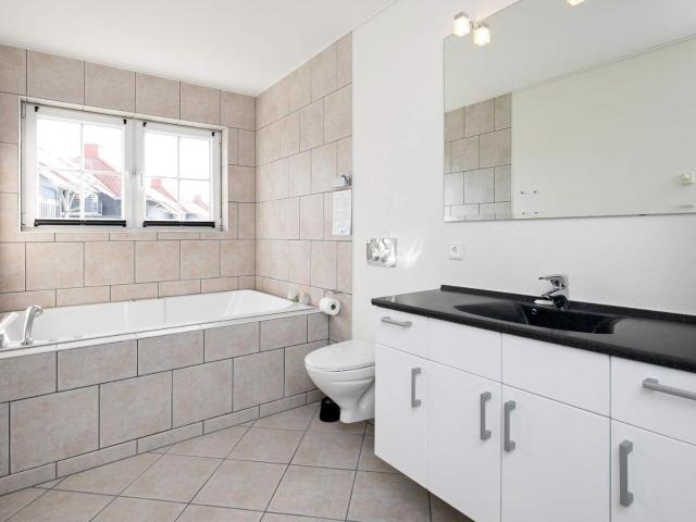 8 person holiday home on a holiday park in Bogense