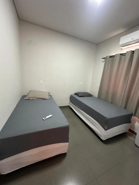 Casa garagem caminhonete exceto Dodge Ram, 2 quartos, espaço para 6 pessoas