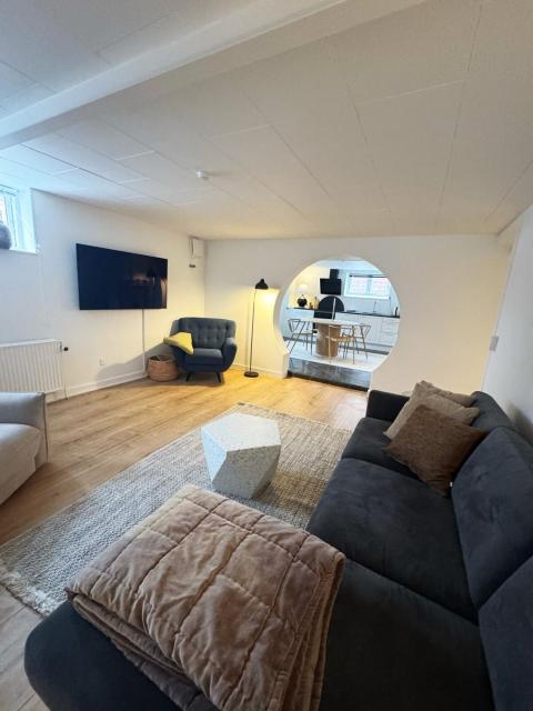 Central and unique basement apartment with parking