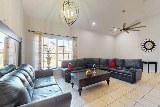 Spacious home with game room and mickey shaped pool and gas grill