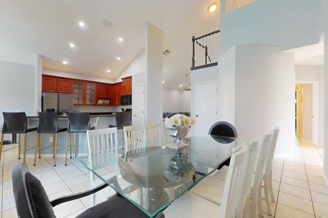 Spacious home with game room and mickey shaped pool and gas grill