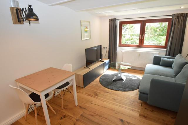 Newly renovated apartment with small garden & service