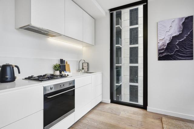 Modern CBD-Edge 2BR Apartment with City Views, Pool, Gym & Sauna in West Melbourne, Near Queen Victoria Market & Marvel Stadium