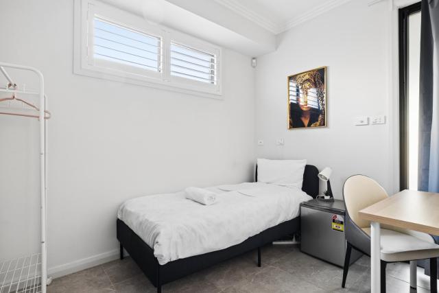 Single Bed at Central Cabramatta Foodies Paradise - Shared Bathroom and Amenities