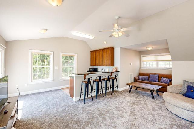 Lakefront home with private dock, kayaks, beach, badminton, firepit, & deck