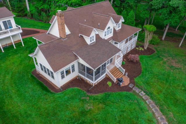 Lakefront home with private dock, kayaks, beach, badminton, firepit, & deck