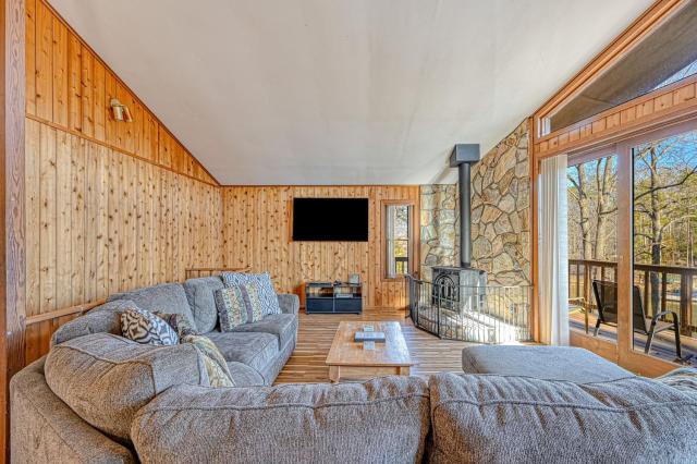 Serene lakefront home with free WiFi, private dock, game room, & central AC