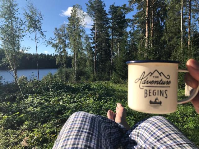 Glamping tent in a forest, lake view