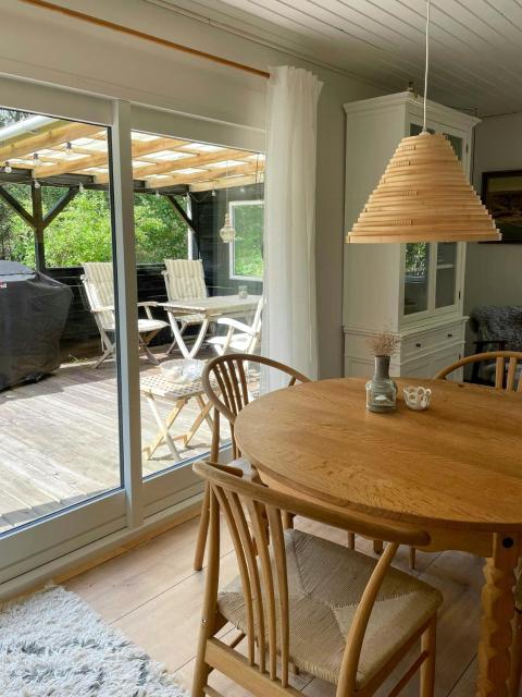 Log cabin on large nature plot with sun
